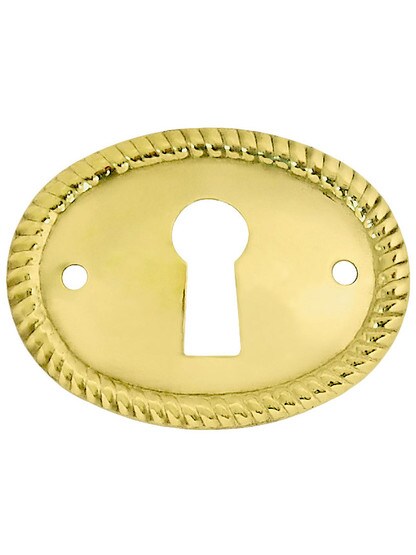Horizontal Oval Keyhole Cover with Rope Design in Un-Lacquered Brass.
